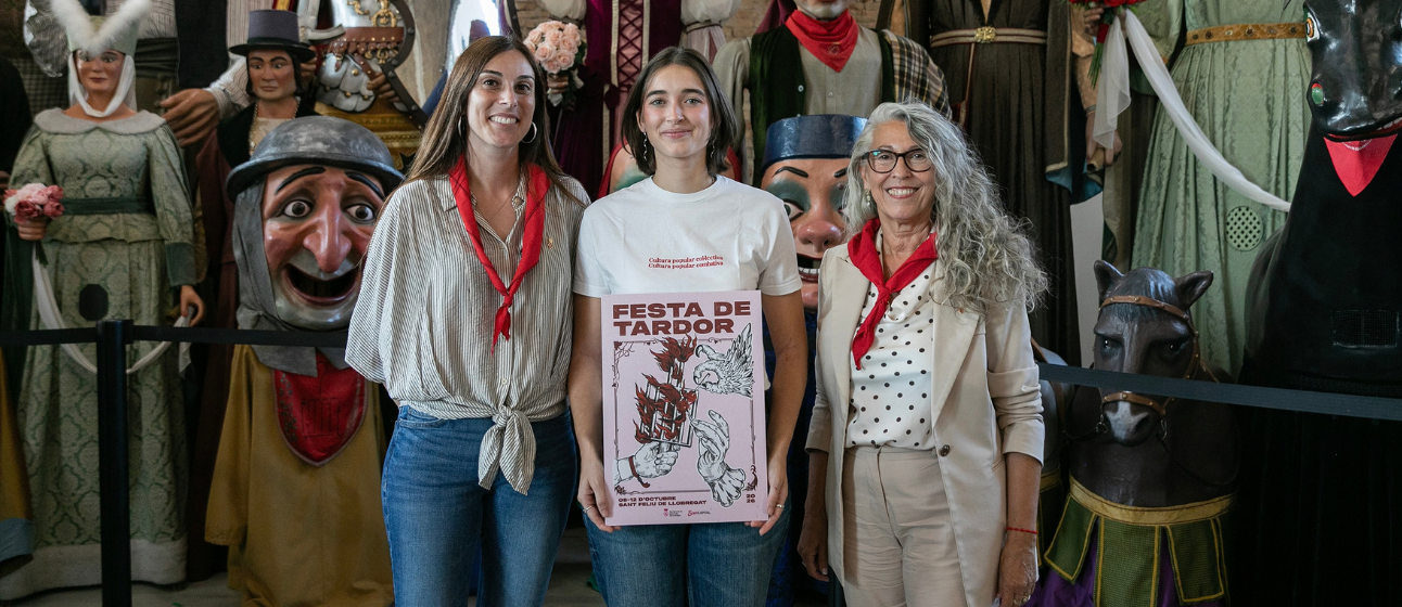Presentació del cartell de la Festa de Tardor 2026 a la Nau de Cultura i Tradicions de Sant Feliu, amb els gegants al fons